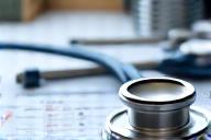 A stethoscope and a heart rate graph