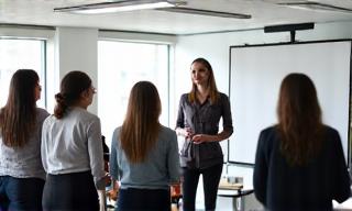 A person leading a training workshop for a small group.